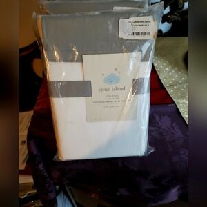 Four packages of cloud island crib skirt